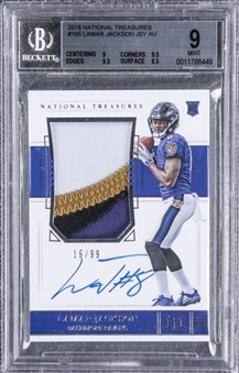 2018 National Treasures #165 Lamar Jackson Signed Game Used Patch Rookie Card (#16/99) – BGS MINT 9/BGS 10